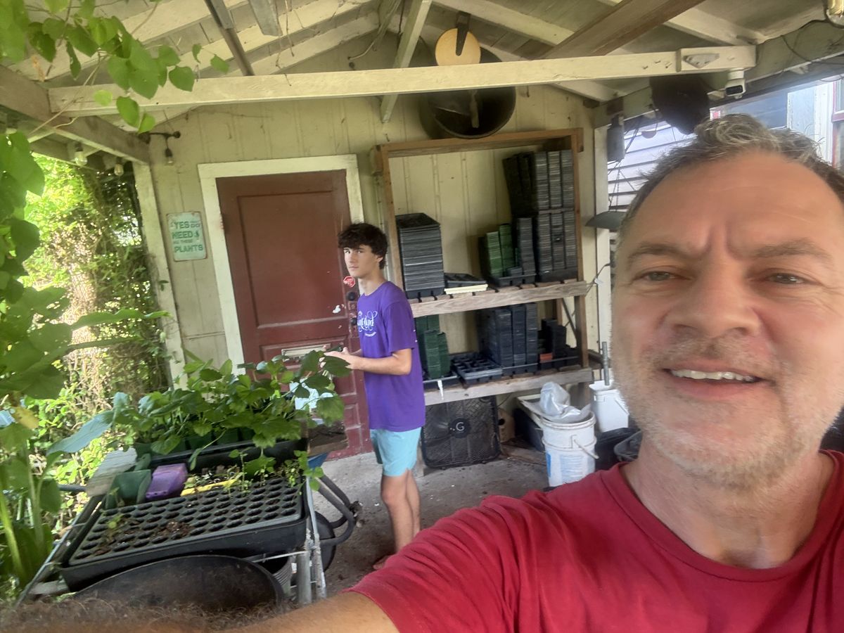 Marcus and a helper at the potting shed